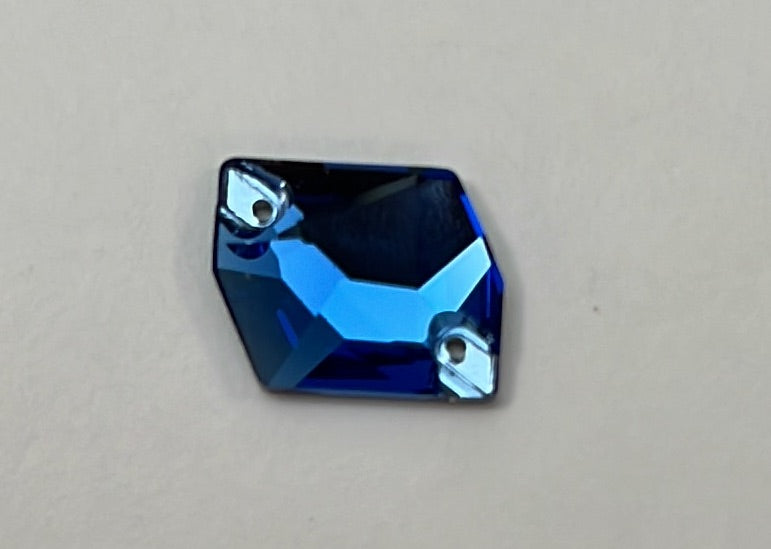Blue gemstone on a beige background