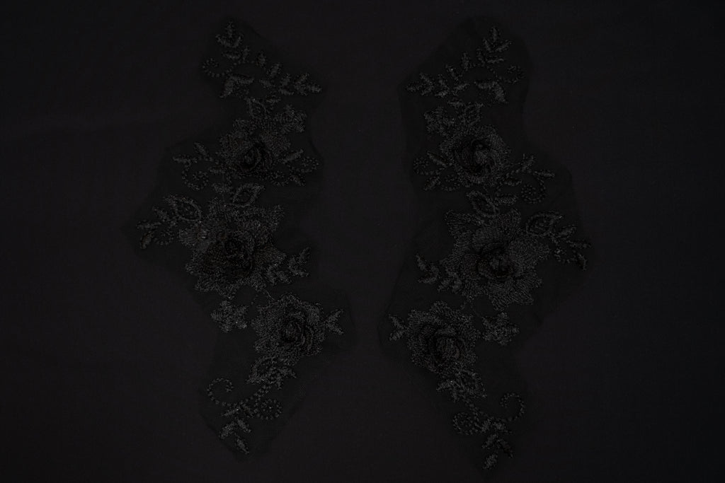 Dark floral arrangement on a black background