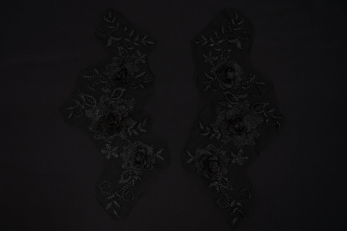 Dark floral arrangement on a black background