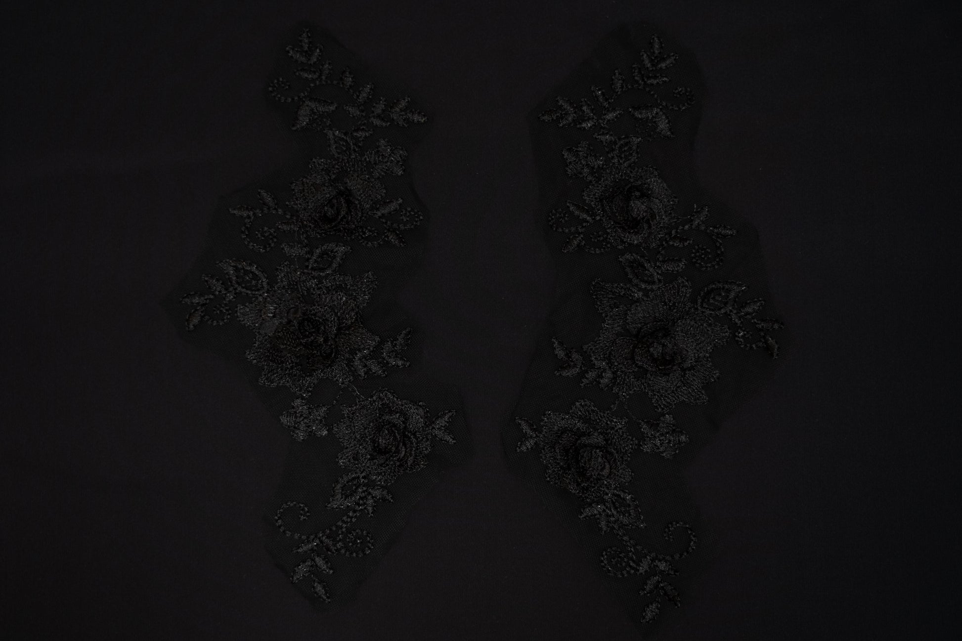 Dark floral arrangement on a black background