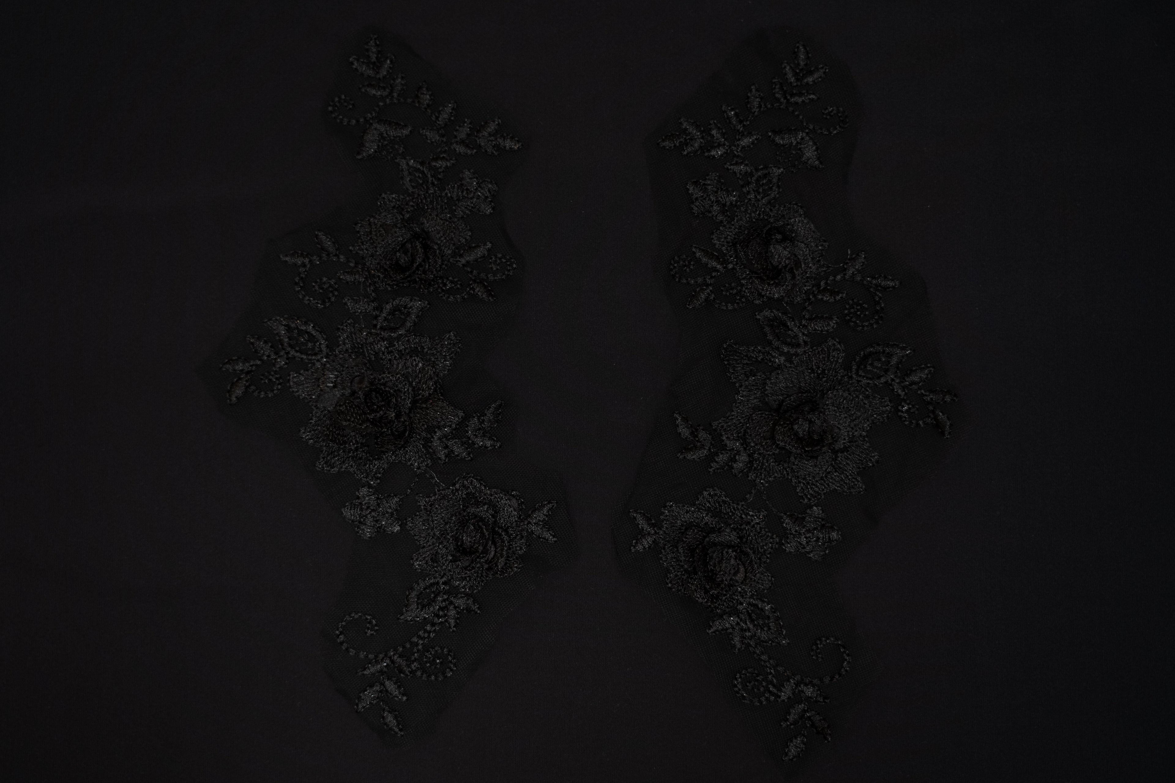 Dark floral arrangement on a black background