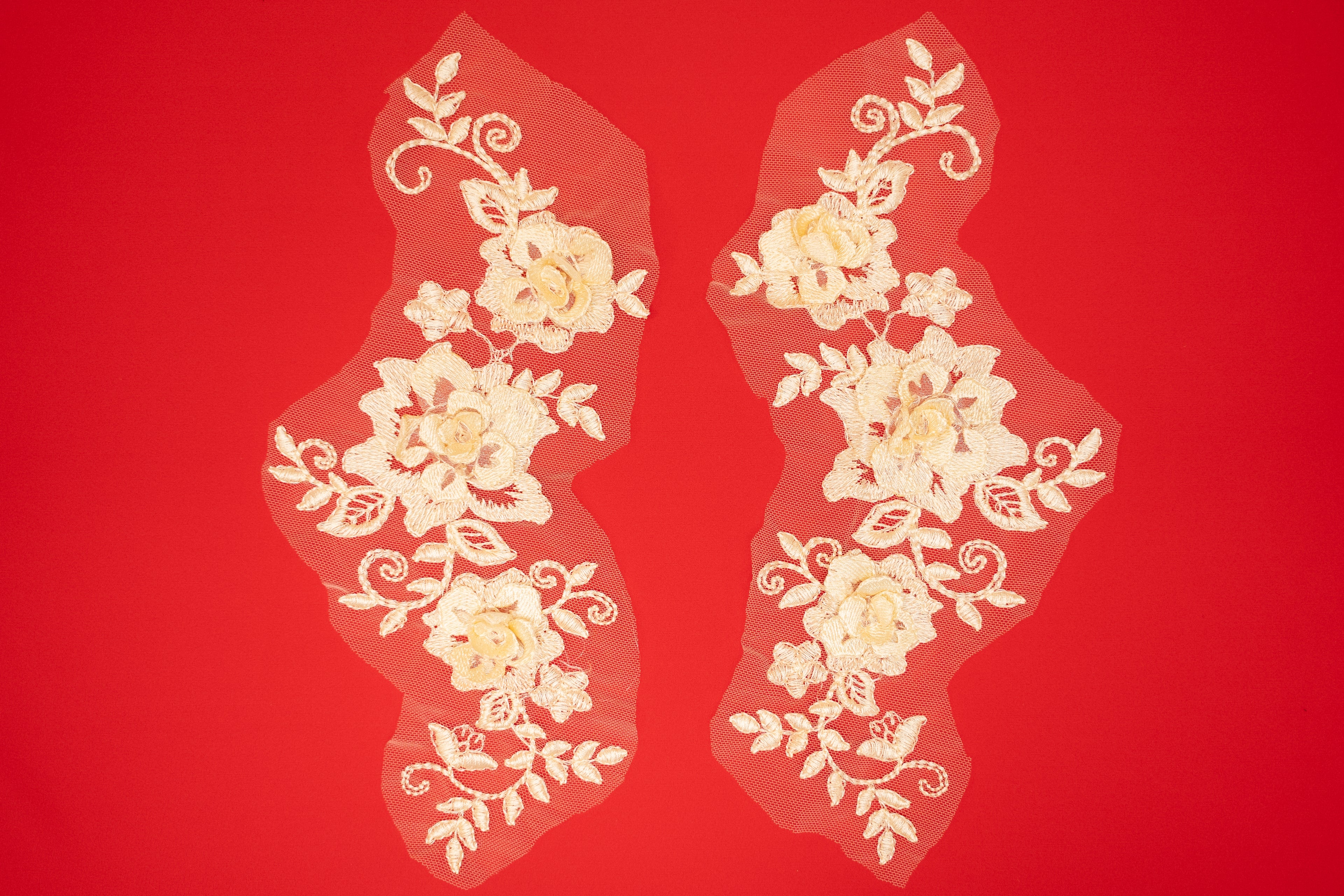Decorative lace with floral patterns on a red background