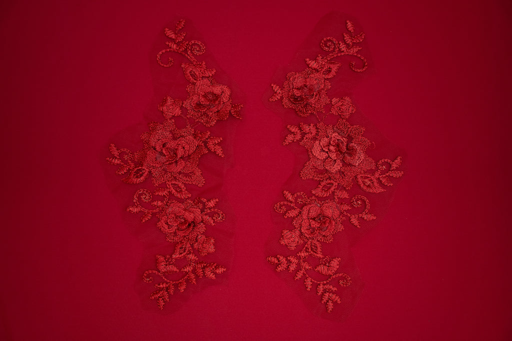 Decorative red lace patterns on a red background