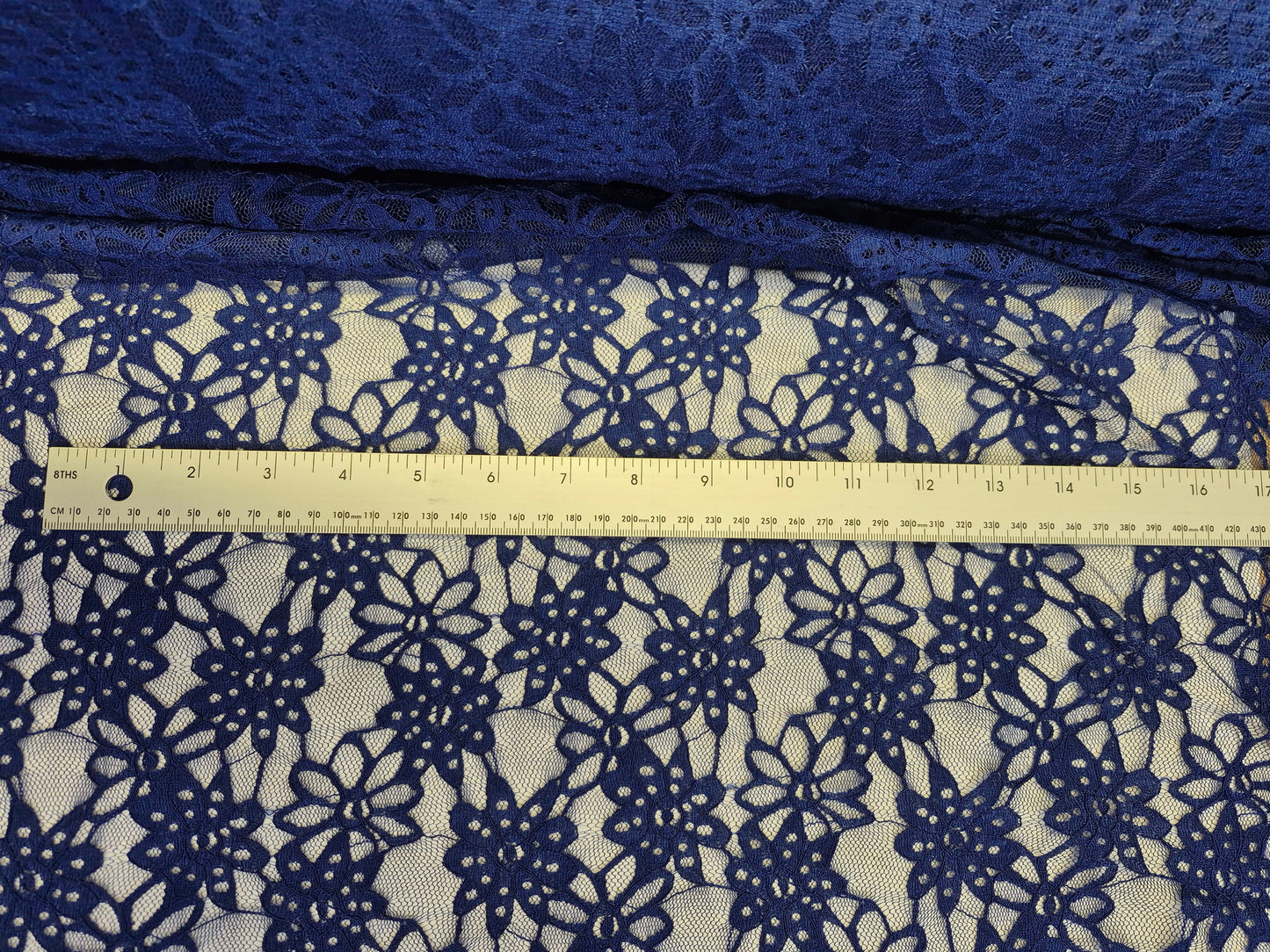 Stretch Lace Sunflower Dark Blue $/foot