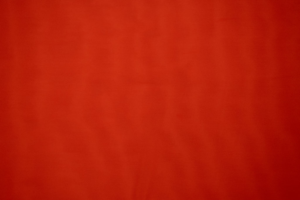 Solid red color swatch with a textured pattern