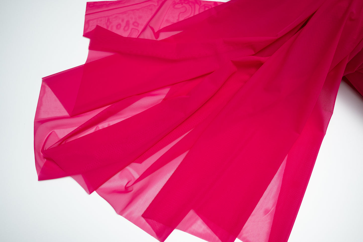 Pink fabric on a white background