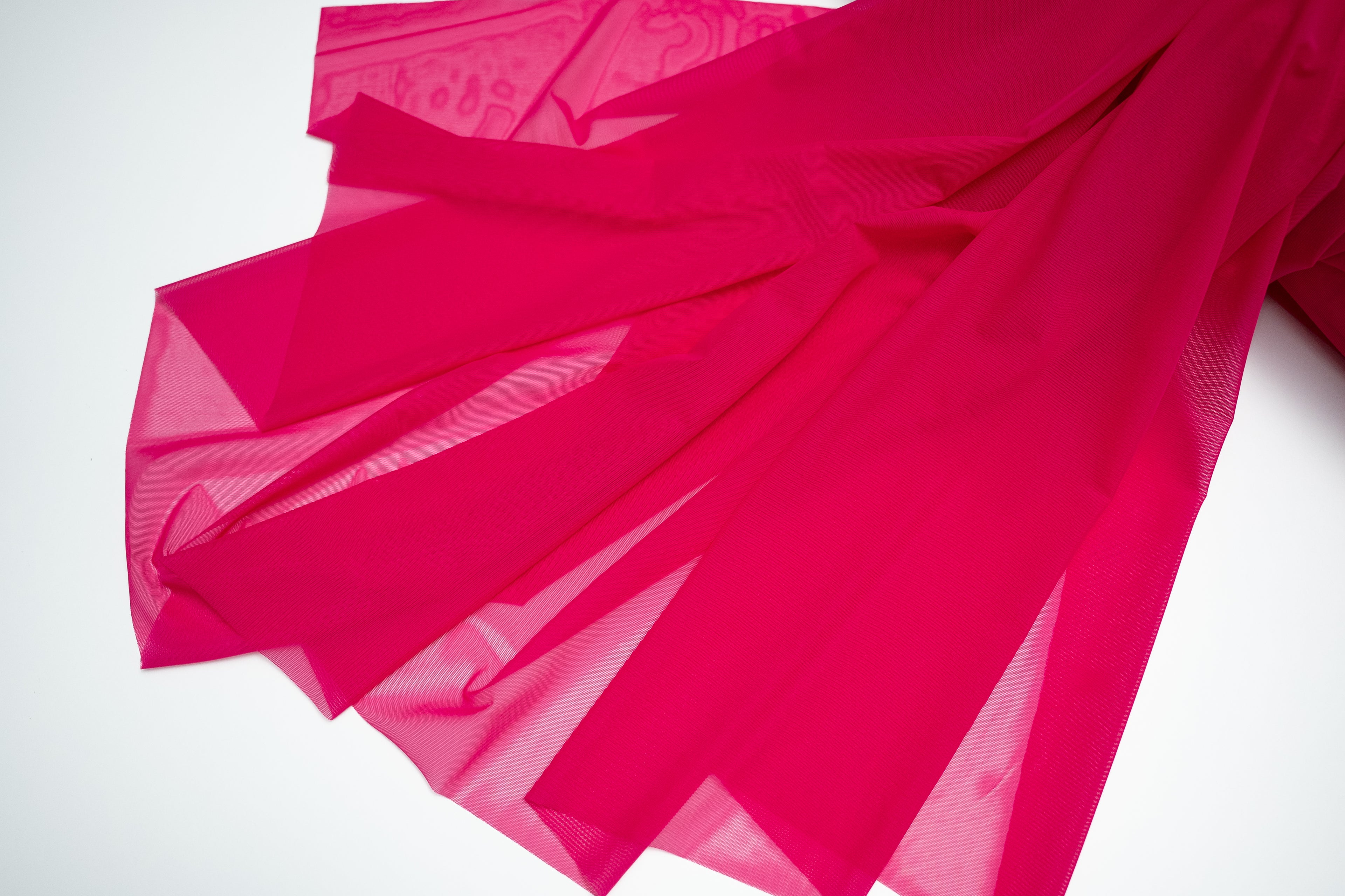 Pink fabric on a white background