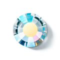 Crystal gemstone with multicolored facets on a white background