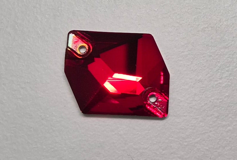 Red gemstone on a gray background